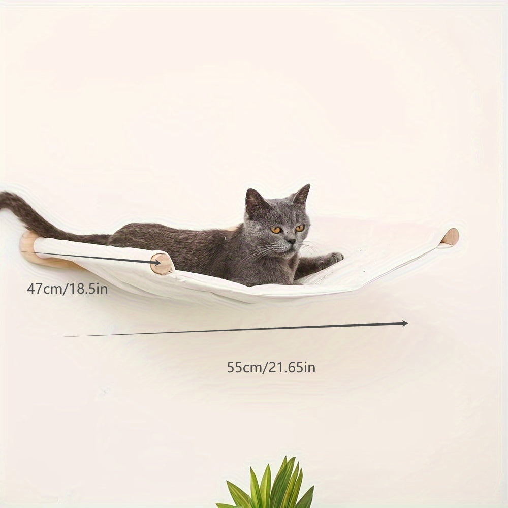 Large gray cat lounging on a wall cat tree indoor activity center hammock, measuring 47cm by 55cm.