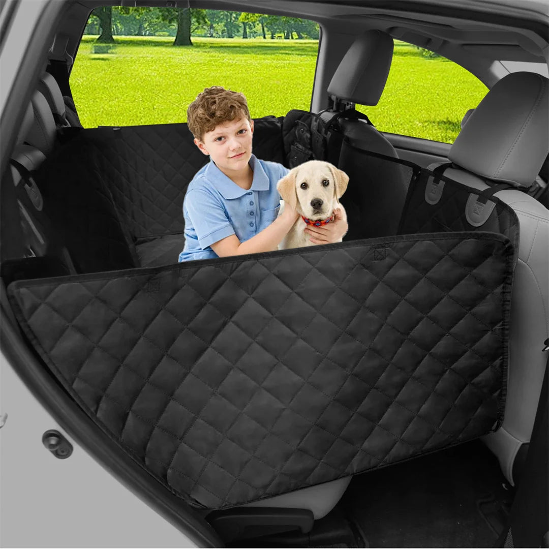 Waterproof dog car seat cover with child and puppy in back seat, featuring comfortable black quilted design.